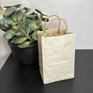 Michael Harvey Craft pop art ceramic paper bag sculpture with paper handles